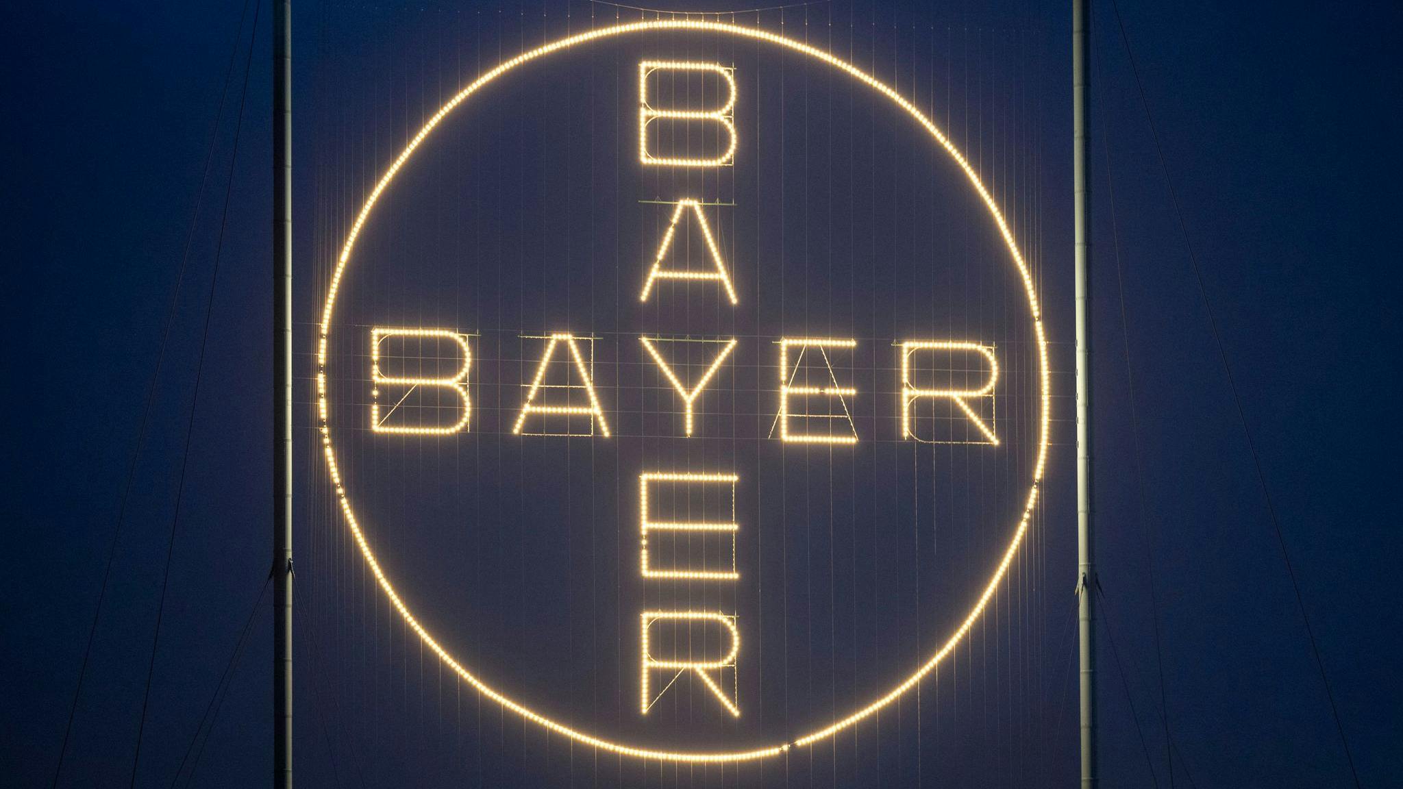The Bayer logo, shines on the company's site in Leverkusen.
