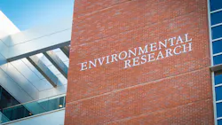 Tall brick building featuring 'ENVIRONMENTAL RESEARCH' sign. Tall brick building featuring 'ENVIRONMENTAL RESEARCH' sign.
