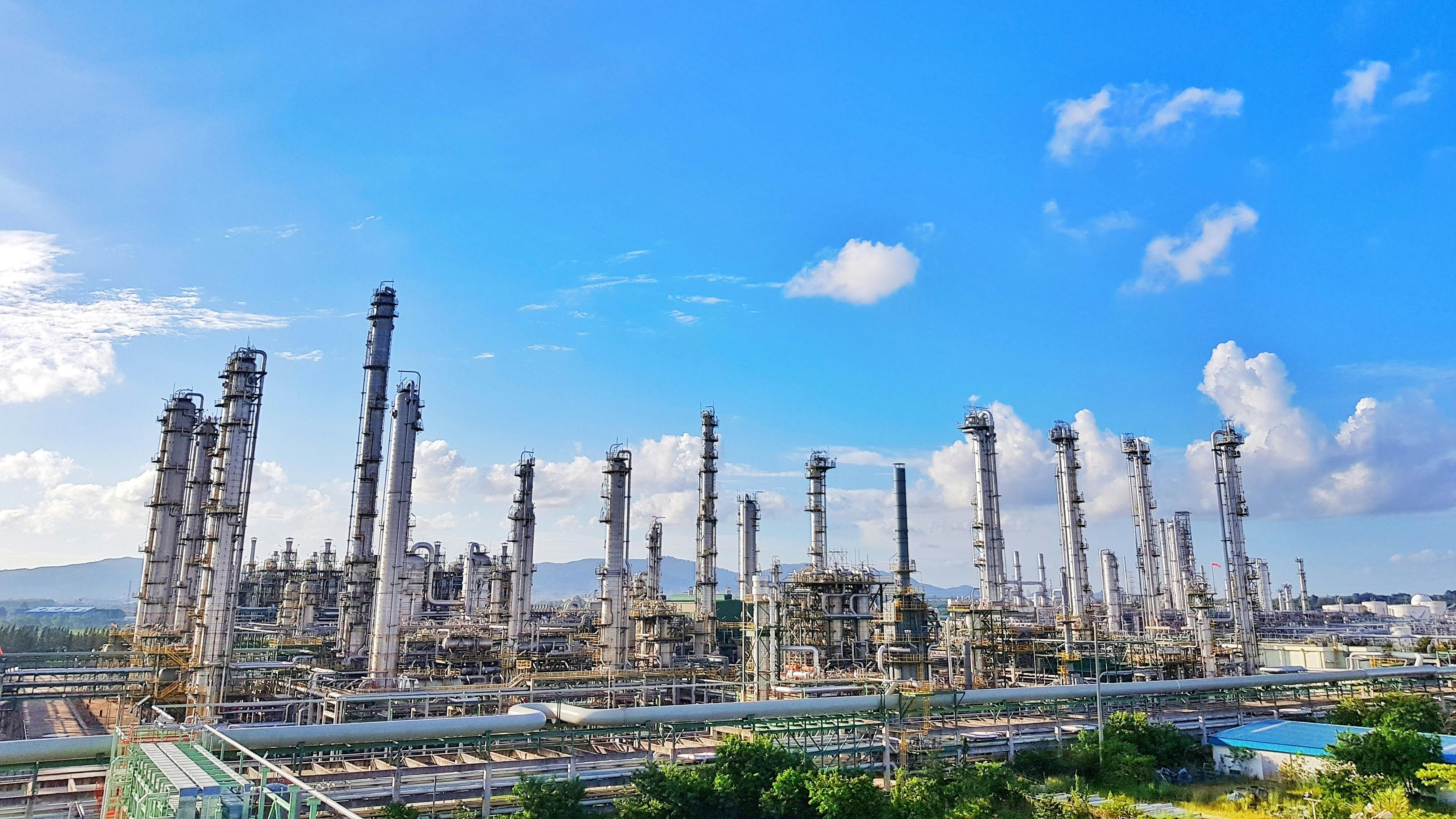 Tower refinery of chemical plant for thermal gas naphtha propylene and ethylene cracker with beautiful blue sky