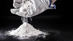 gloved hand cups white powder dropping it into a pile gloved hand cups white powder dropping it into a pile