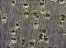 Figure 3. Pitting attack on metal surface. Figure 3. Pitting attack on metal surface.