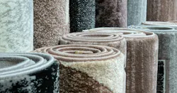 Variety of carpets rolled up Variety of carpets rolled up