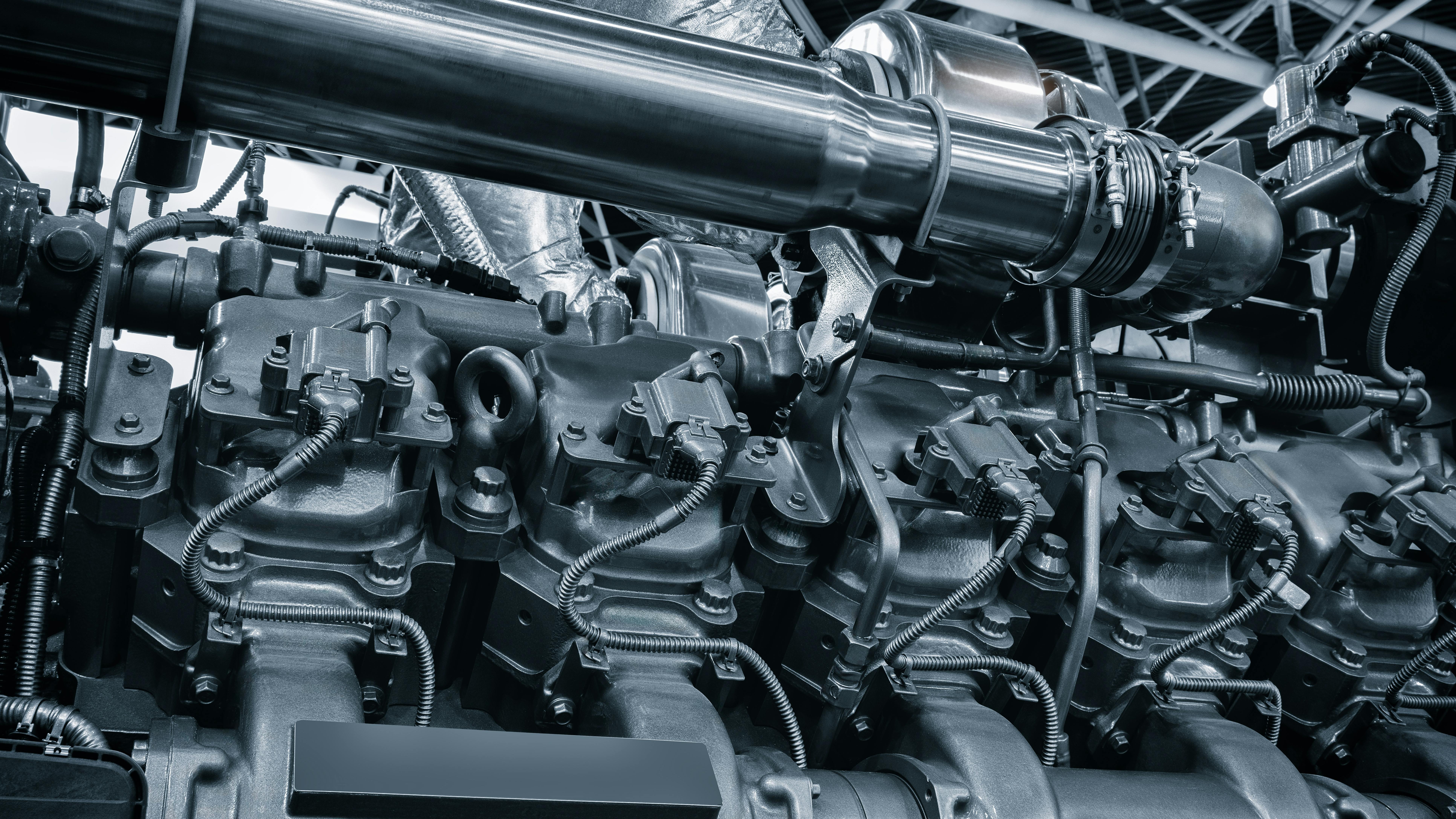 black and white photo of large industrial diesel engine