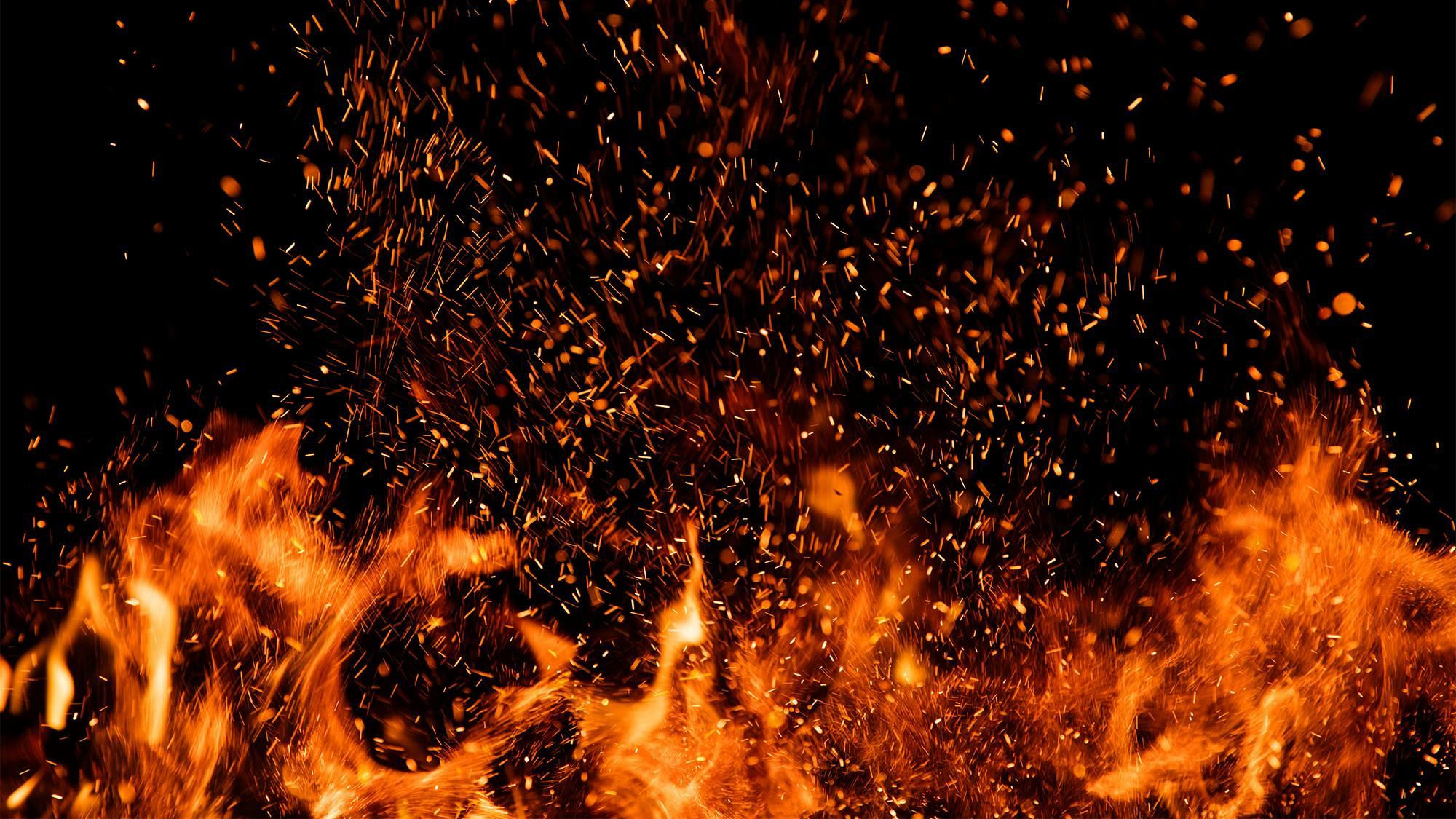 fire and ashes on black background