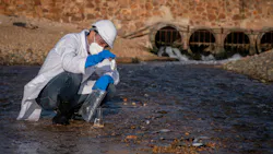 Scientist conducts air and water quality research along riverbed Scientist conducts air and water quality research along riverbed