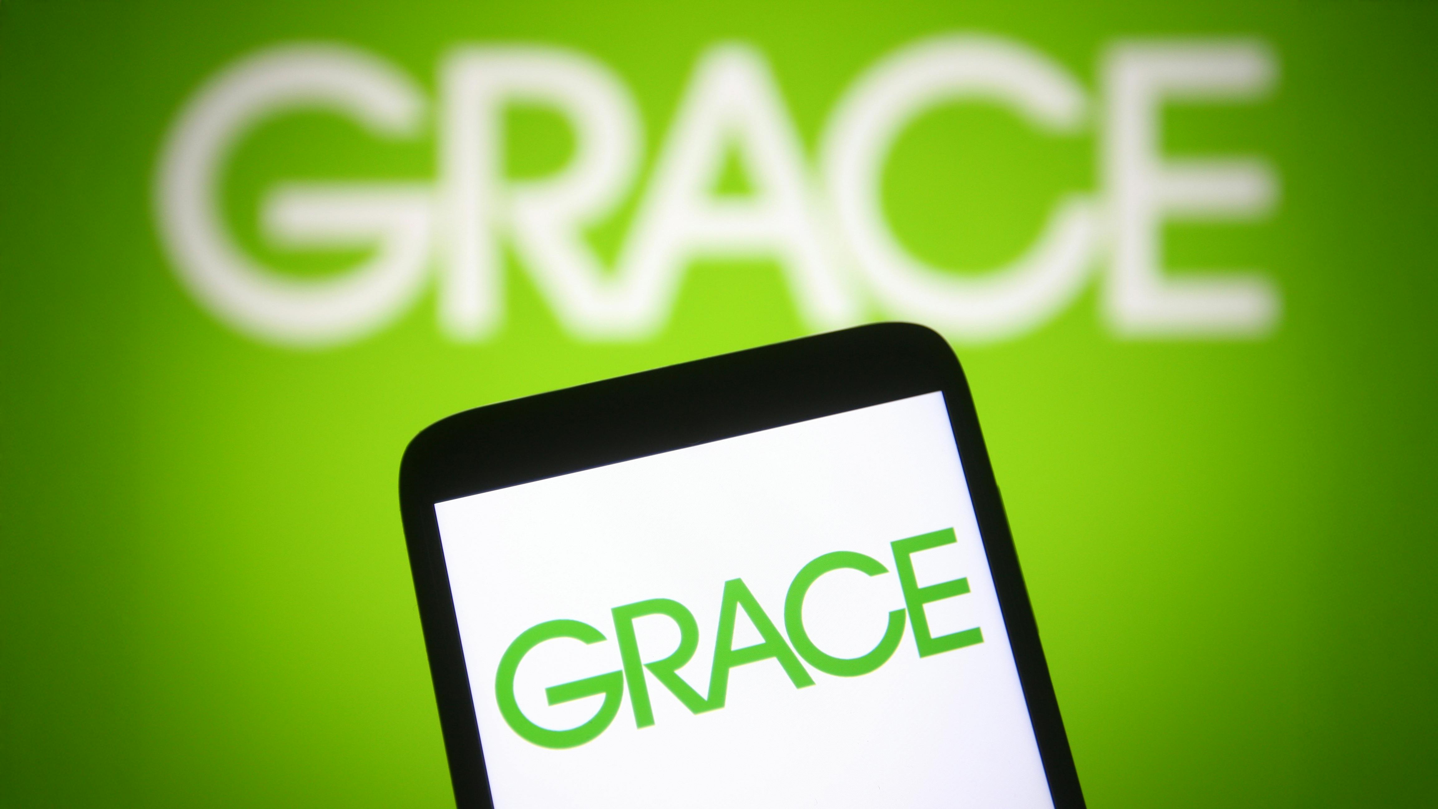 Grace logo in green text on phone screen with larger Grace logo blurred in background