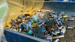 Industrial battery recycling process with conveyor belts filled with old batteries, barrels of discarded batteries, disassembled car batteries and sorted raw material Industrial battery recycling process with conveyor belts filled with old batteries, barrels of discarded batteries, disassembled car batteries and sorted raw material