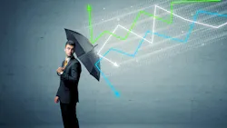 man in suit holding umbrella with economic line graphs 'falling' onto and bouncing off umbrella man in suit holding umbrella with economic line graphs 'falling' onto and bouncing off umbrella