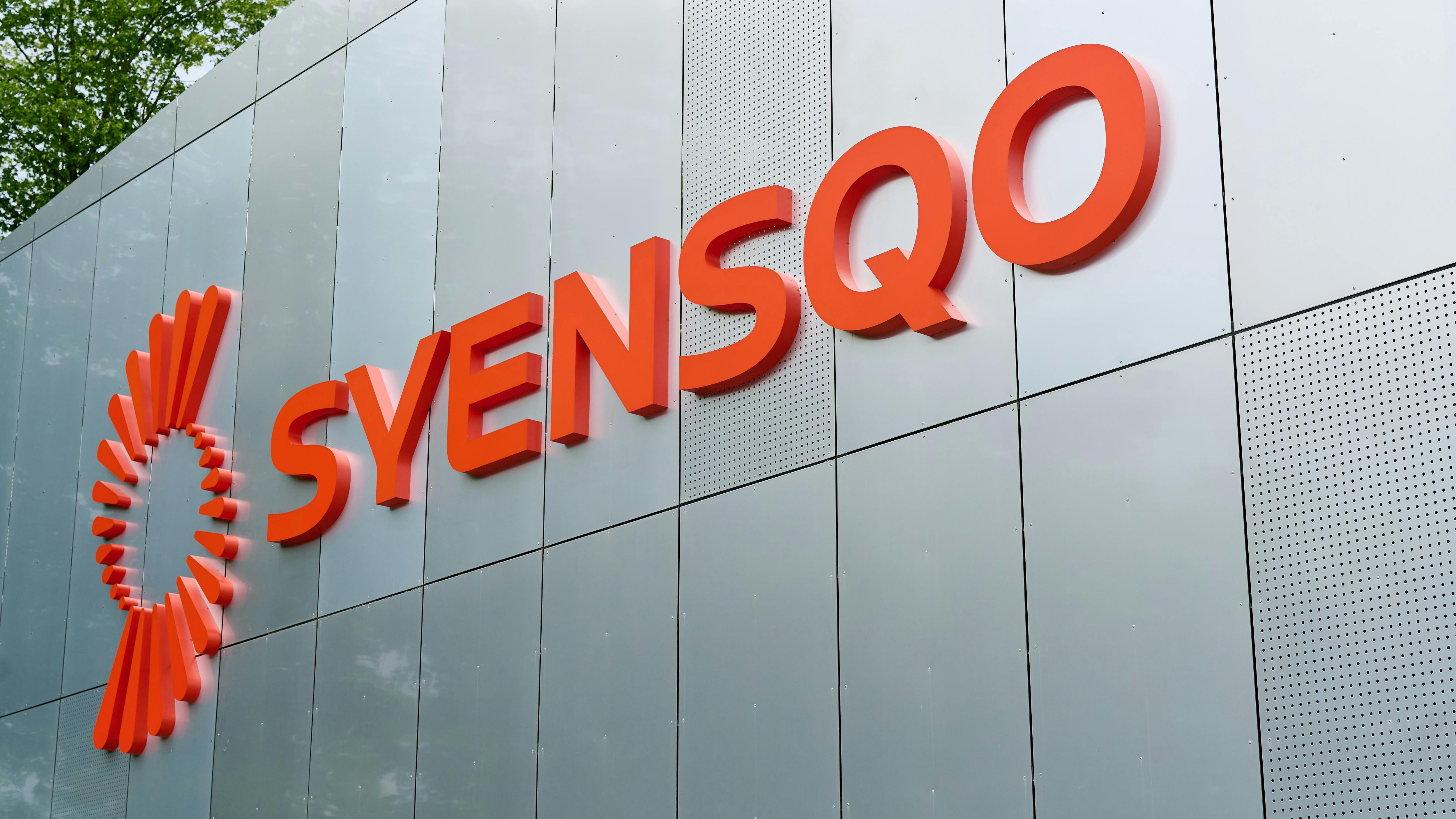 Syensqo headquarters logo on side of building