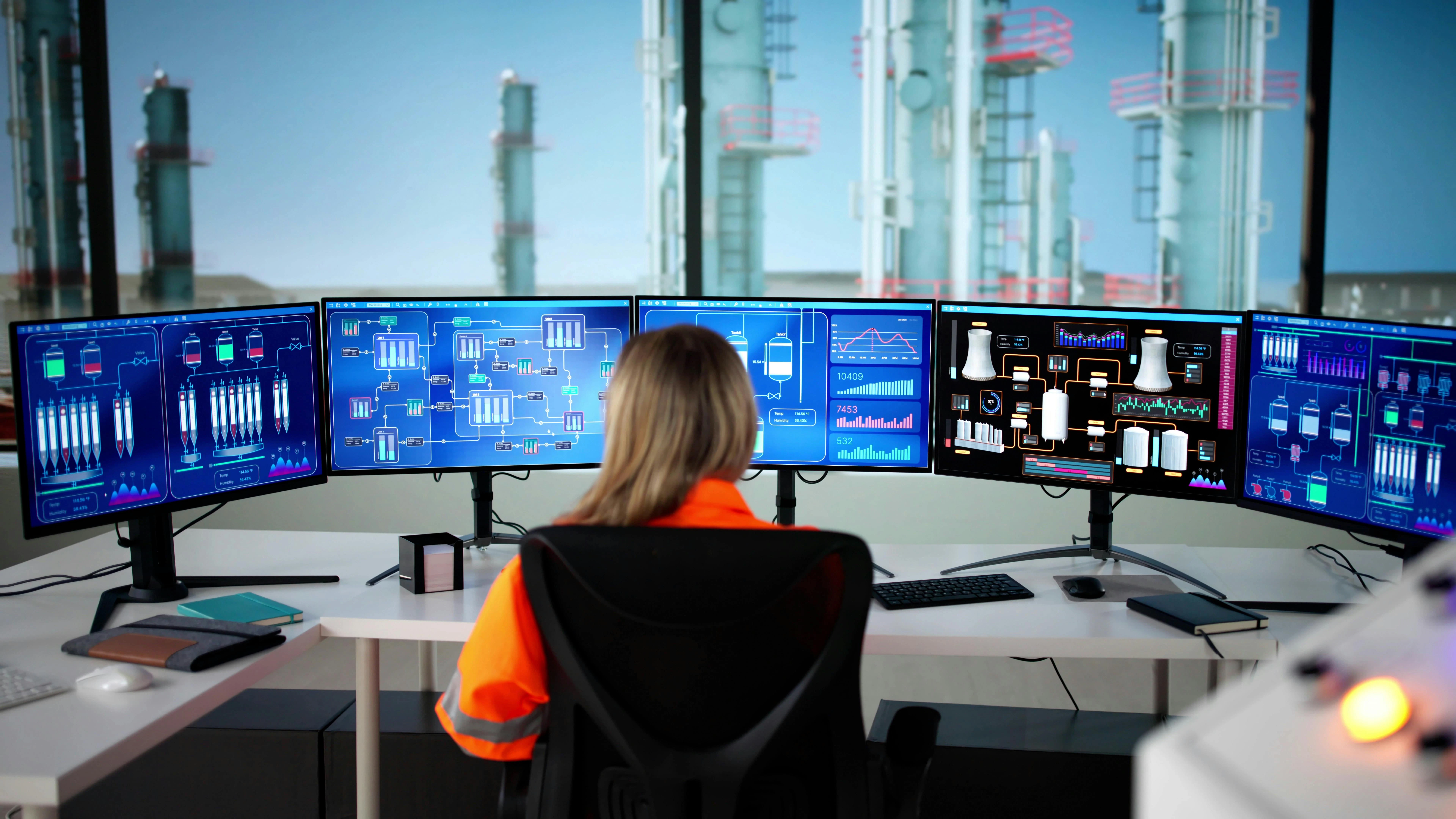 Young Female Engineer Monitoring Oil And Gas Production With Scada.