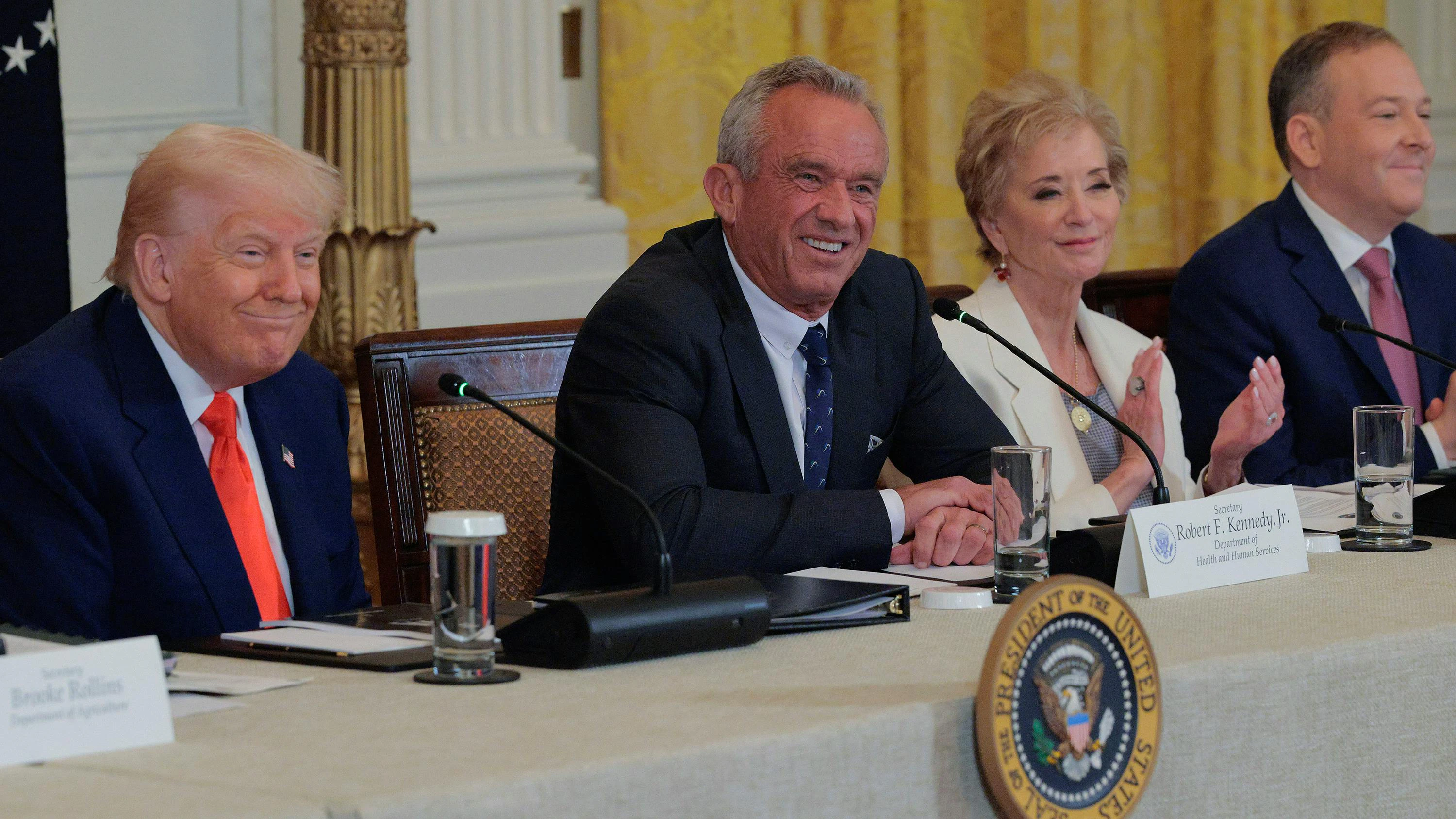From left, U.S. President Donald Trump, Health and Human Services Secretary Robert F. Kennedy Jr., Education Secretary Linda McMahon and Environmental Protection Agency Administrator Lee Zeldin hold an event for a new Make America Healthy Again Commission report in the East Room of the White House on May 22, 2025, in Washington, D.C. (Chip Somodevilla/Getty Images/TNS)