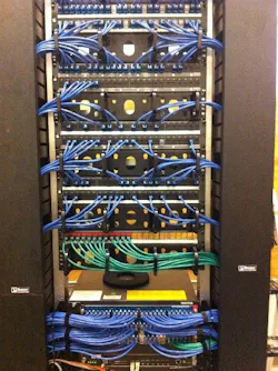 A typically busy patch panel organized and outfitted with Secure RJ45 connectors A typically busy patch panel organized and outfitted with Secure RJ45 connectors