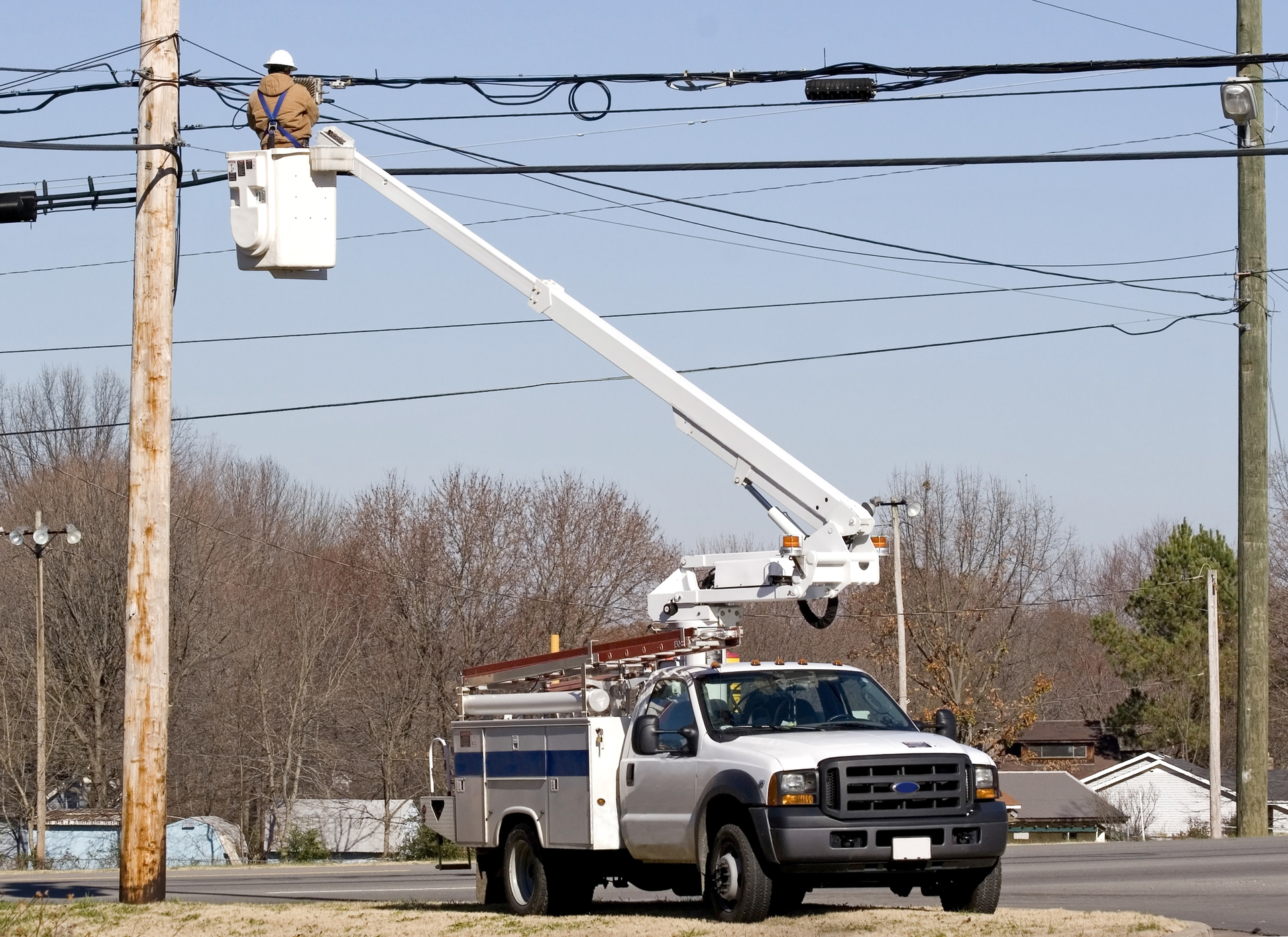 Cable technician working in a bucket truck.