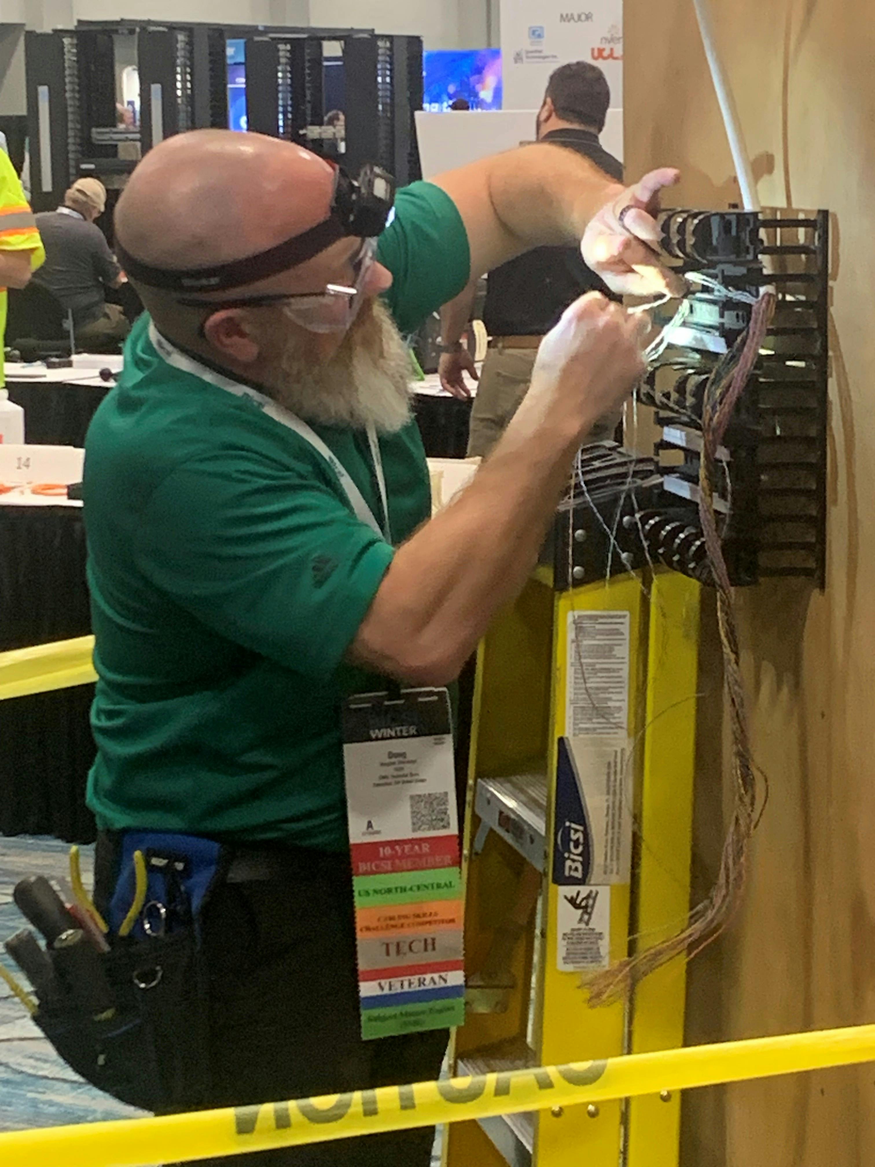 Eventual repeat champion Douglas Sherwood competes during the Cabling Skills Challenge in January 2026. During his acceptance speech after being crowned Installer of the Year, Sherwood called on other industry professionals to make the effort to compete in the 2027 event. He also called on his peers to help the industry by volunteering their time and talents.