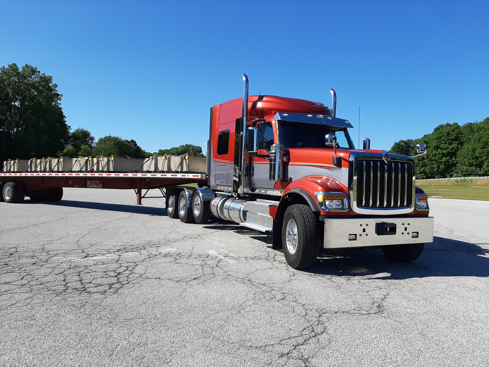This HX tractor has a handsome face and strong underpinnings, and orange-and-gray paint suits its intended duties of hauling large, heavy construction equipment. HX&rsquo;s original aluminum cab was replaced with a larger steel cabin several years ago. This truck has a 73-inch, high-roof integrated sleeper.