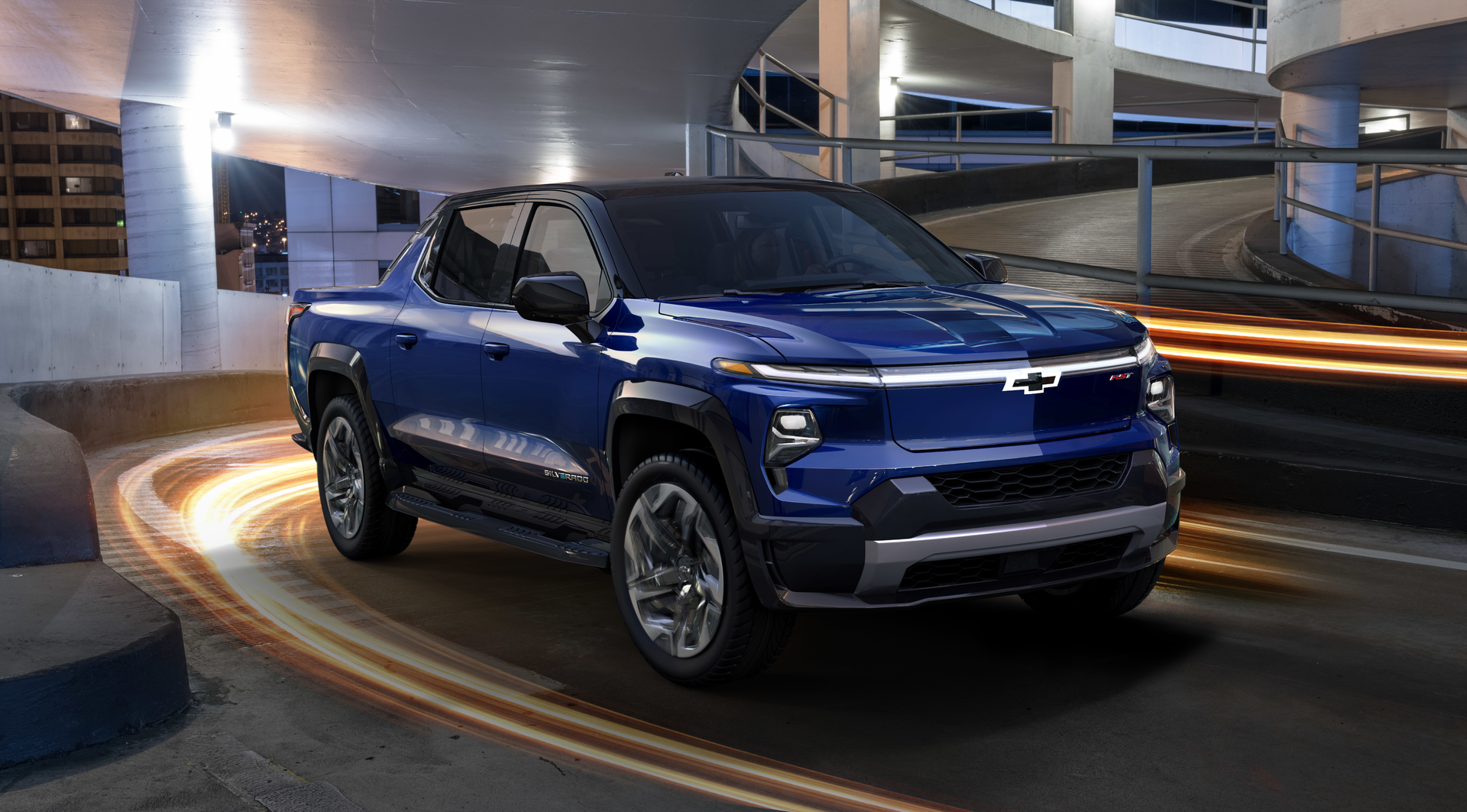 Chevrolet&rsquo;s Silverado EV is shown here in deluxe RST trim, but it will initially appear in simpler WT trim when it hits the market in 2024. It will have two motors, all-wheel-drive, and four-wheel steer with range of up to 400 miles. Rear window and wall can be stowed to extend the bed floor into the cab.