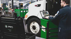 Technician Working On A Truck Technician Working On A Truck