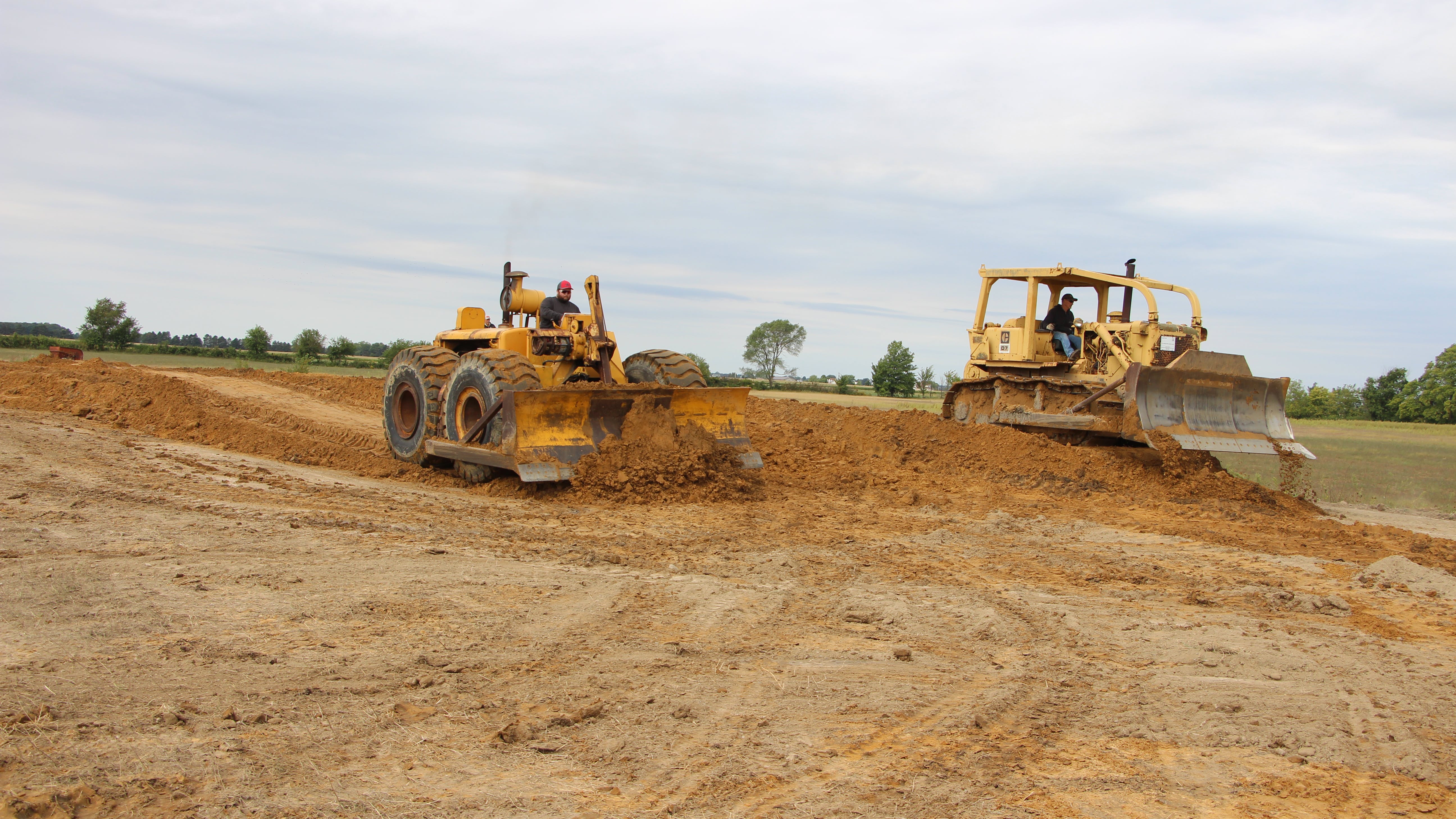 Don Martin&rsquo;s 1956 LeTourneau-Westinghouse C Tournadozer and the National Construction Equipment Museum&rsquo;s circa 1972 D7F compare dozer technologies during the HCEA&rsquo;s 2022 International Convention and Old Equipment Exposition. All else being equal, a C was said to be the match of a D8.