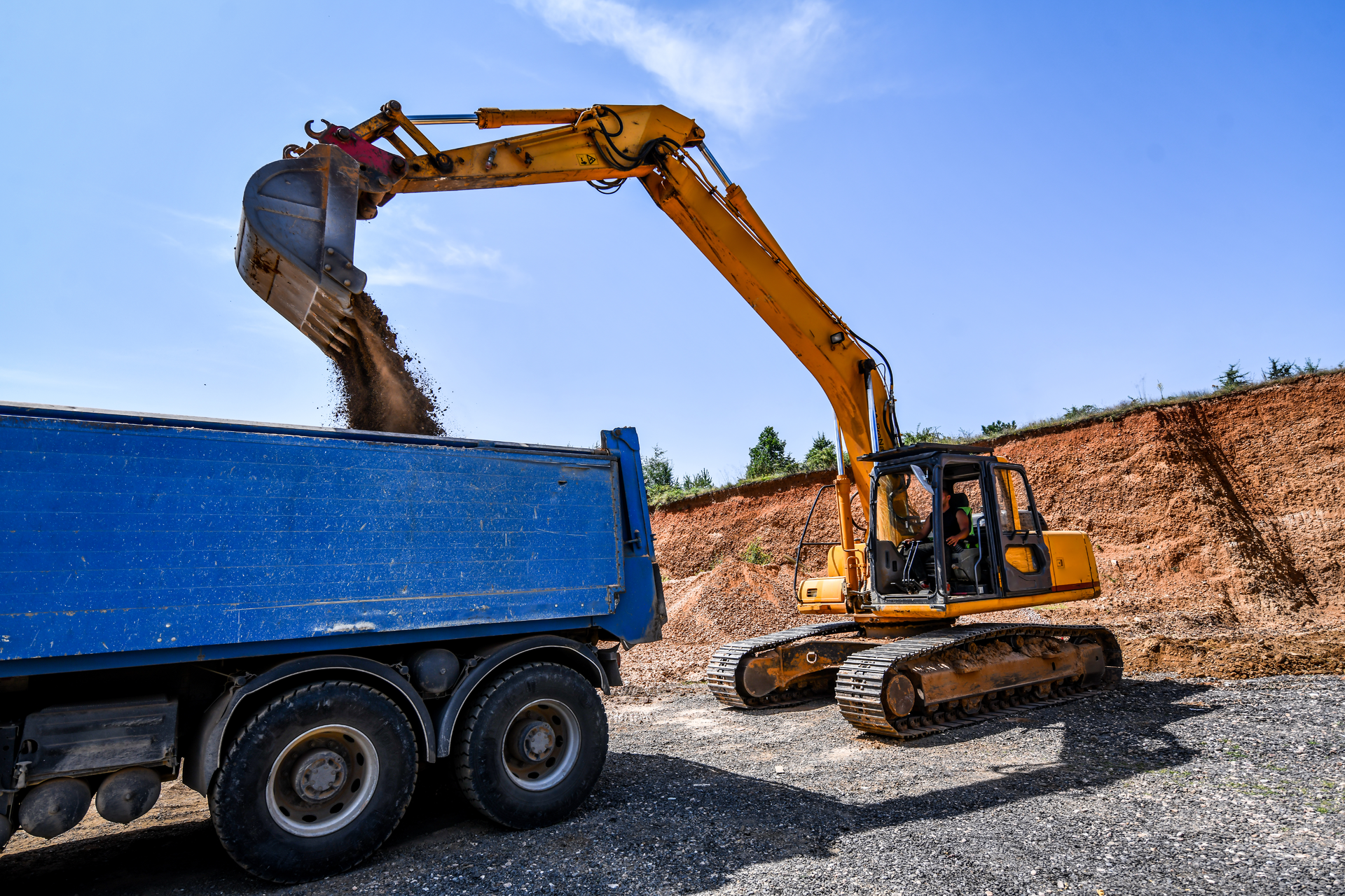 Excavator Loads Truck