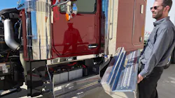 Wide cab looks inviting, and three grab handles—two inside and one on the exhaust stack—make for a safe and easy climb into it. Doors are triple sealed for quietness and interior cleanliness. Jacob White, product marketing director who helped design the 589, holds the cover for the battery box that includes a small tool compartment. Wide cab looks inviting, and three grab handles—two inside and one on the exhaust stack—make for a safe and easy climb into it. Doors are triple sealed for quietness and interior cleanliness. Jacob White, product marketing director who helped design the 589, holds the cover for the battery box that includes a small tool compartment.