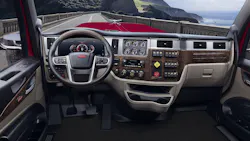 Cab mockup shows 589’s digital instrument cluster (left, ahead of the wheel), including the combination speedometer and tachometer. Electro-mechanical gauges on center panel show engine and drive axle temperatures and pressures. Woodgrain and brushed metal highlight the upscale trim in this cab; the test daycab had plainer but still pleasant interior panels. Cab mockup shows 589’s digital instrument cluster (left, ahead of the wheel), including the combination speedometer and tachometer. Electro-mechanical gauges on center panel show engine and drive axle temperatures and pressures. Woodgrain and brushed metal highlight the upscale trim in this cab; the test daycab had plainer but still pleasant interior panels.