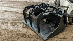 Up close of bucket grapple attachment. Up close of bucket grapple attachment.