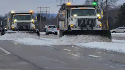 A trio of single-rear-axle plow trucks sporting green and amber strobes cleans a stretch of Ohio highway after a storm has passed. Green lights are used only on snowplows, differentiating them from other road-maintenance equipment with amber-only lights. A trio of single-rear-axle plow trucks sporting green and amber strobes cleans a stretch of Ohio highway after a storm has passed. Green lights are used only on snowplows, differentiating them from other road-maintenance equipment with amber-only lights.