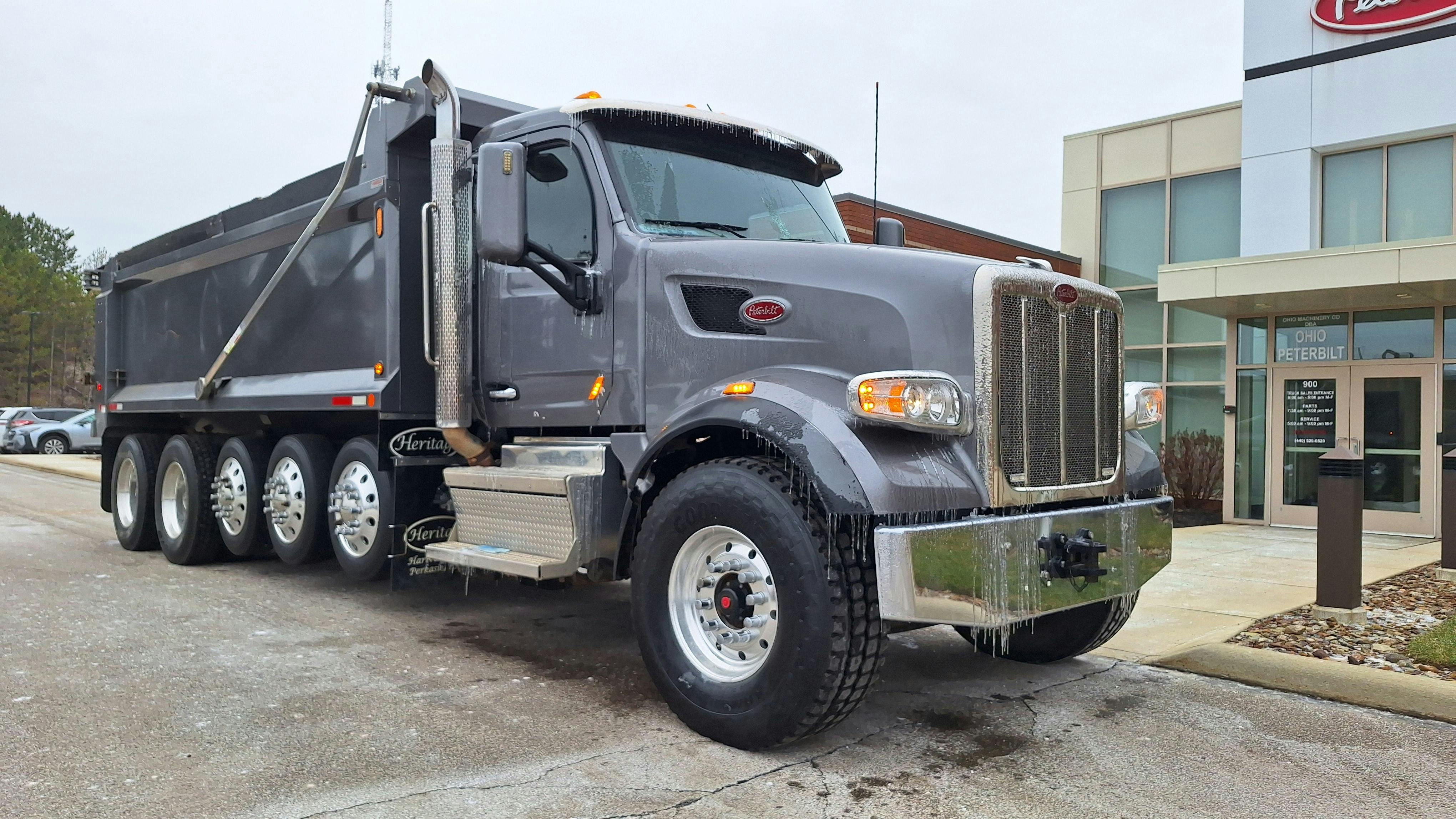 Gray truck on a gray day, but a bright driving experience: 2021 Model 567 dump is ready to roll at Ohio Peterbilt. It has very low miles, the right specs for northeastern Ohio, and looks and performs like new. That makes it a compelling argument for buying &ldquo;used.&rdquo;