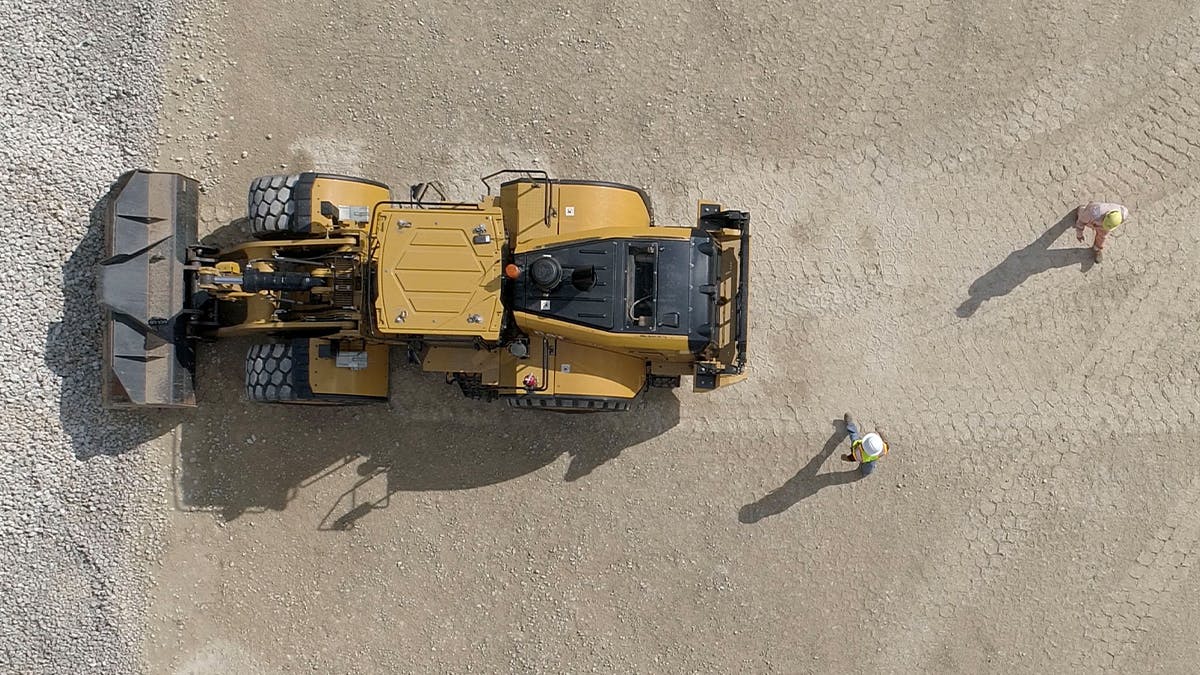 The optional warning system uses radar and vision sensors to detect hazard potential, alert operators, and inhibit motion when initiating reverse motion.