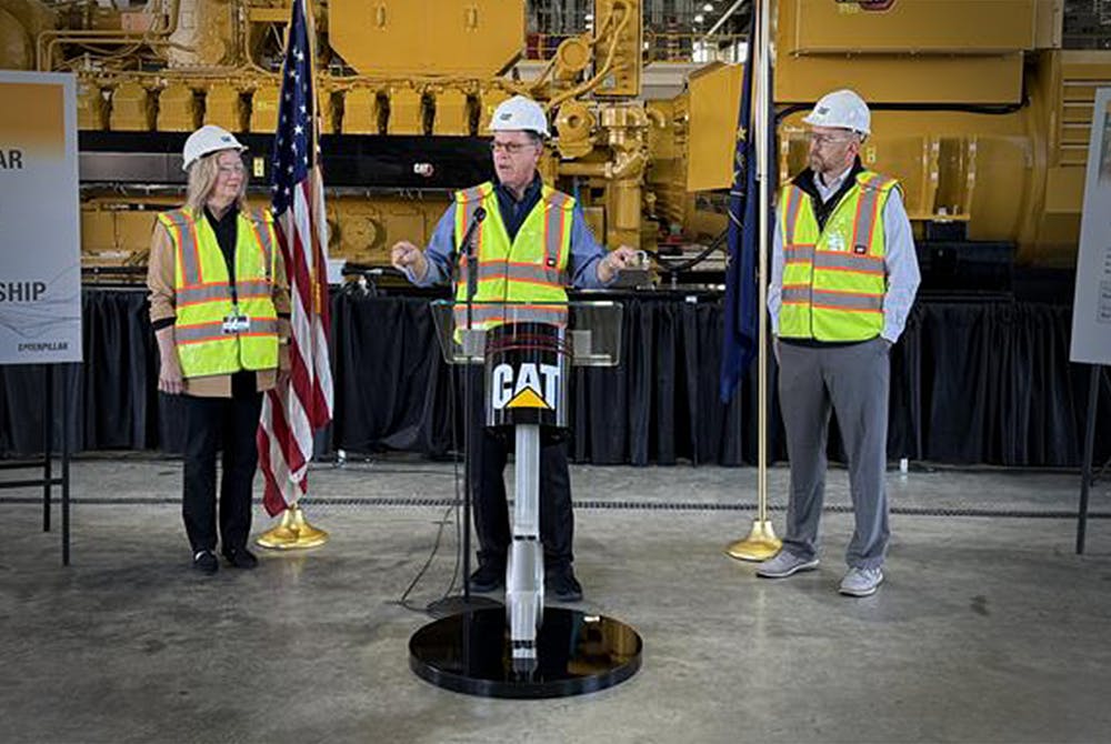 Christy Pambianchi, Caterpillar chief human resources officer; Indiana Governor Mike Braun; and Jason Kaiser, Caterpillar president of energy and transportation group.