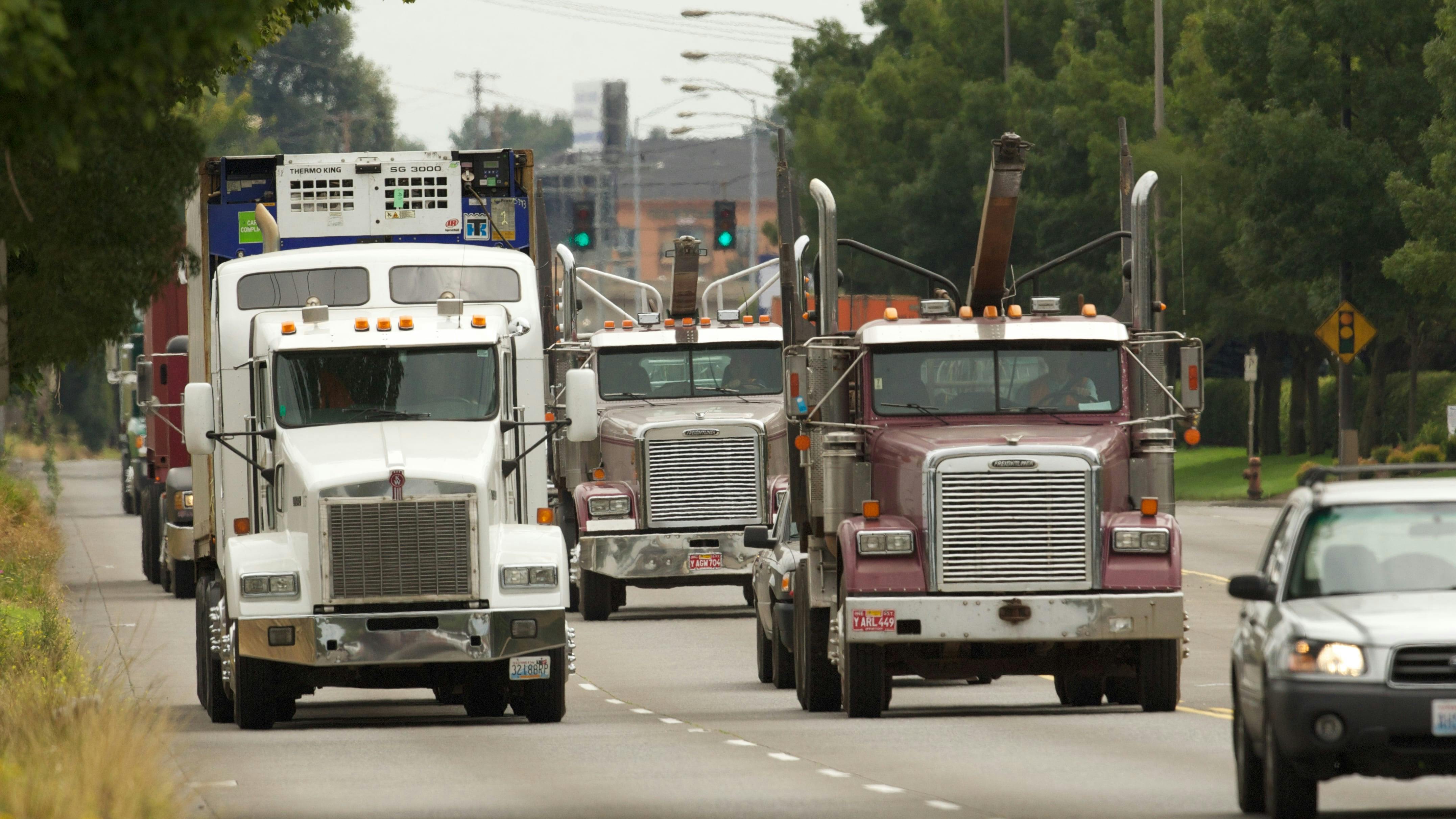 Trucks head for the Port of Portland and the industrial district near Kelley Point Park. City officials said they&rsquo;re staying the course on Portland&rsquo;s signature climate policy on replacing diesel with renewable fuels, despite a push to roll it back from an industry-dominated advisory group.