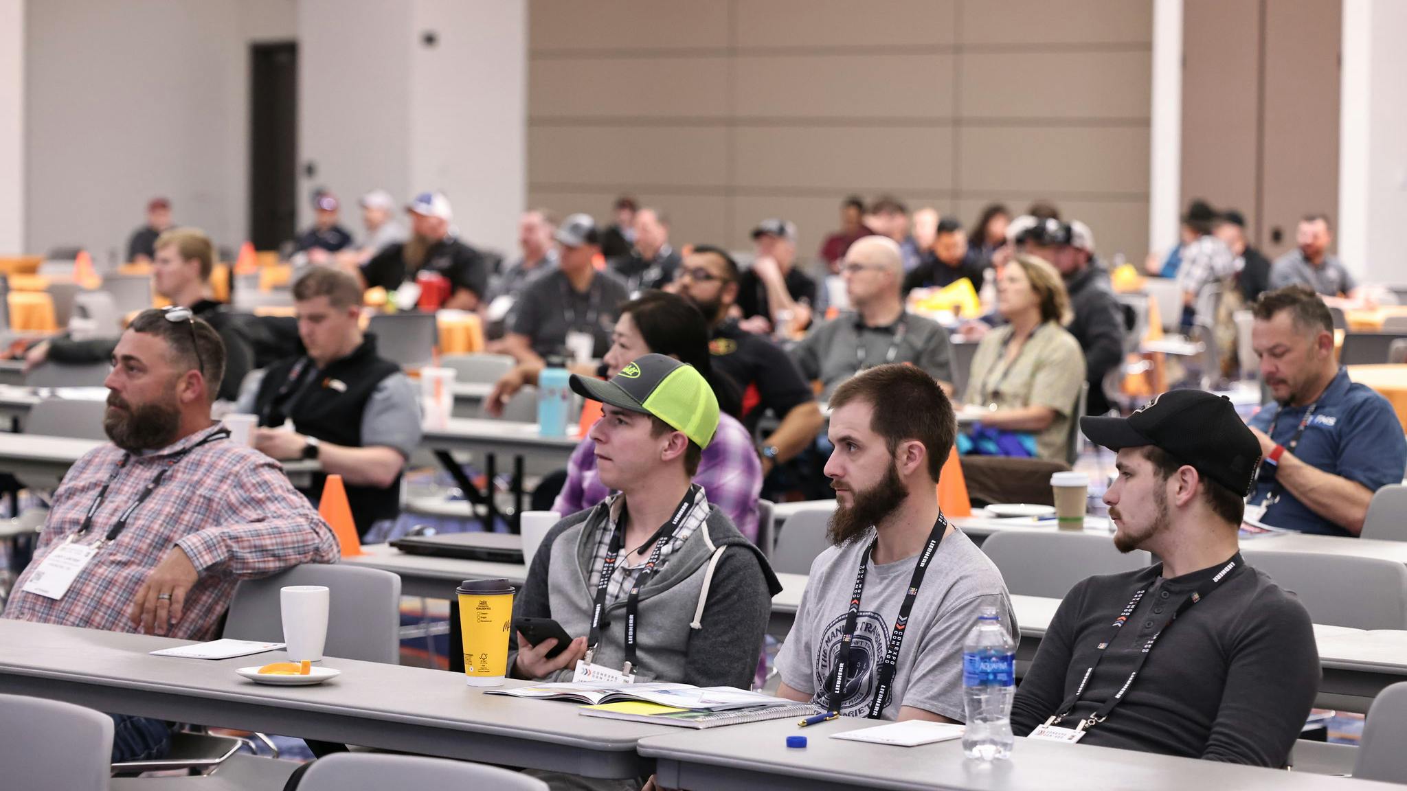Attendees listen to a Conexpo 2023 education session.