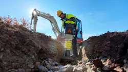 Ammann ATR 59 Rammer in a ditch excavator in the background Ammann ATR 59 Rammer in a ditch excavator in the background