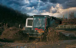 Prinoth Panther T23r Crawler Carrier rolling through the mud. Prinoth Panther T23r Crawler Carrier rolling through the mud.