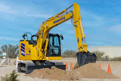 Komatsu PC158USLCi-12 excavator digging in the dirt Komatsu PC158USLCi-12 excavator digging in the dirt