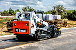 Bobcat T595 compact track loader with a sweeper attachment Bobcat T595 compact track loader with a sweeper attachment