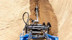 Blue Diamond Trencher Attachment cutting through dirt Blue Diamond Trencher Attachment cutting through dirt