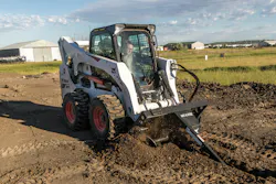 Bobcat trencher attachment on a skid steer Bobcat trencher attachment on a skid steer