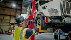 Technician photographing truck Technician photographing truck