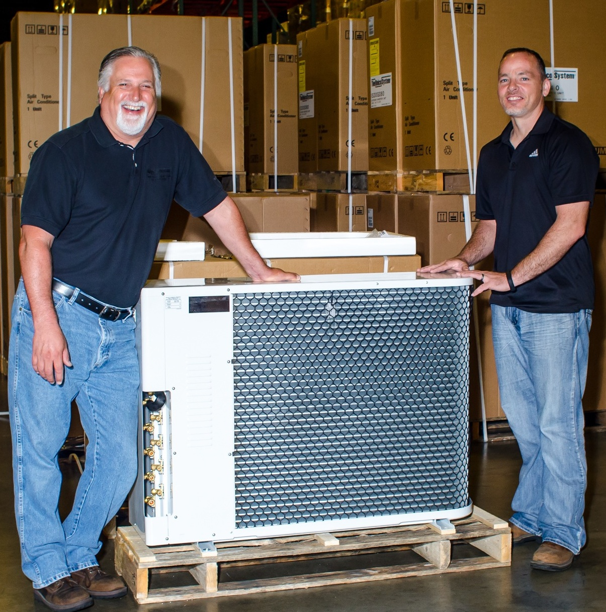 Good news Steve Intagliata left and Bob Martin of Unico Inc were all smiles when a shipment of the new iSeries multisplit HVAC systems arrived at their facility in St Louis