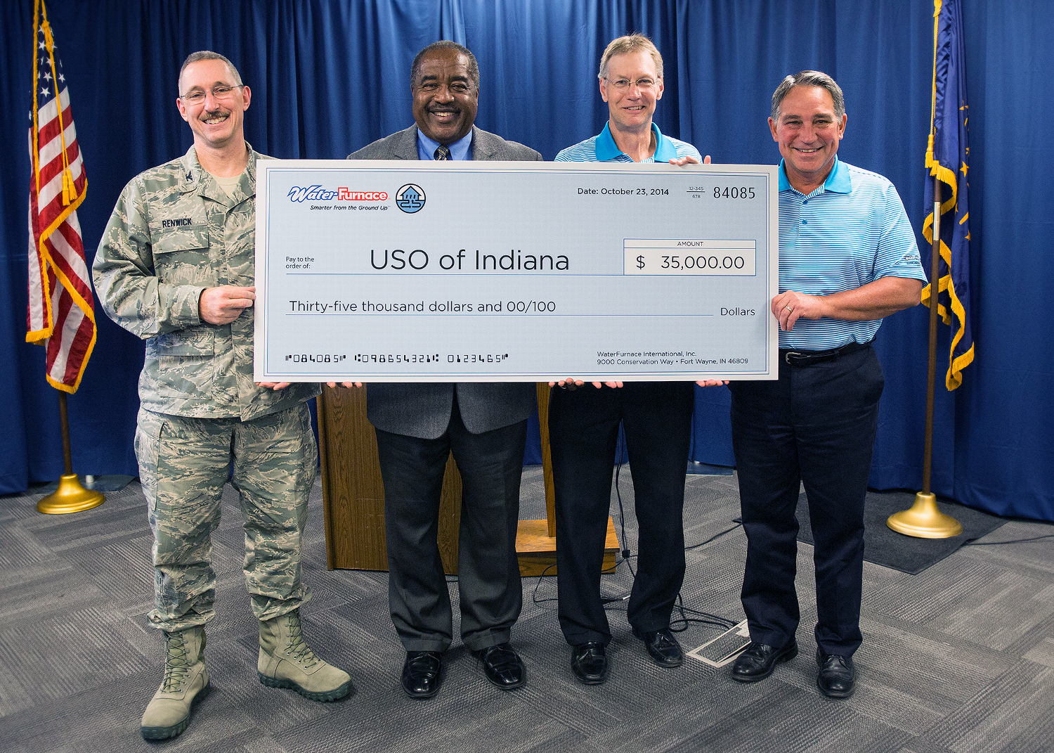 Tom Huntington right WaterFurnace president and CEO presented a check to the USO of Indiana during an Oct 23 news conference at the companyrsquos corporate headquarters in Fort Wayne IN With him from left are Col Patrick Renwick Wing Commander 122nd ANG James Pridgen President amp CEO USO of Indiana Carl Huber vice president corporate quality WaterFurnace International