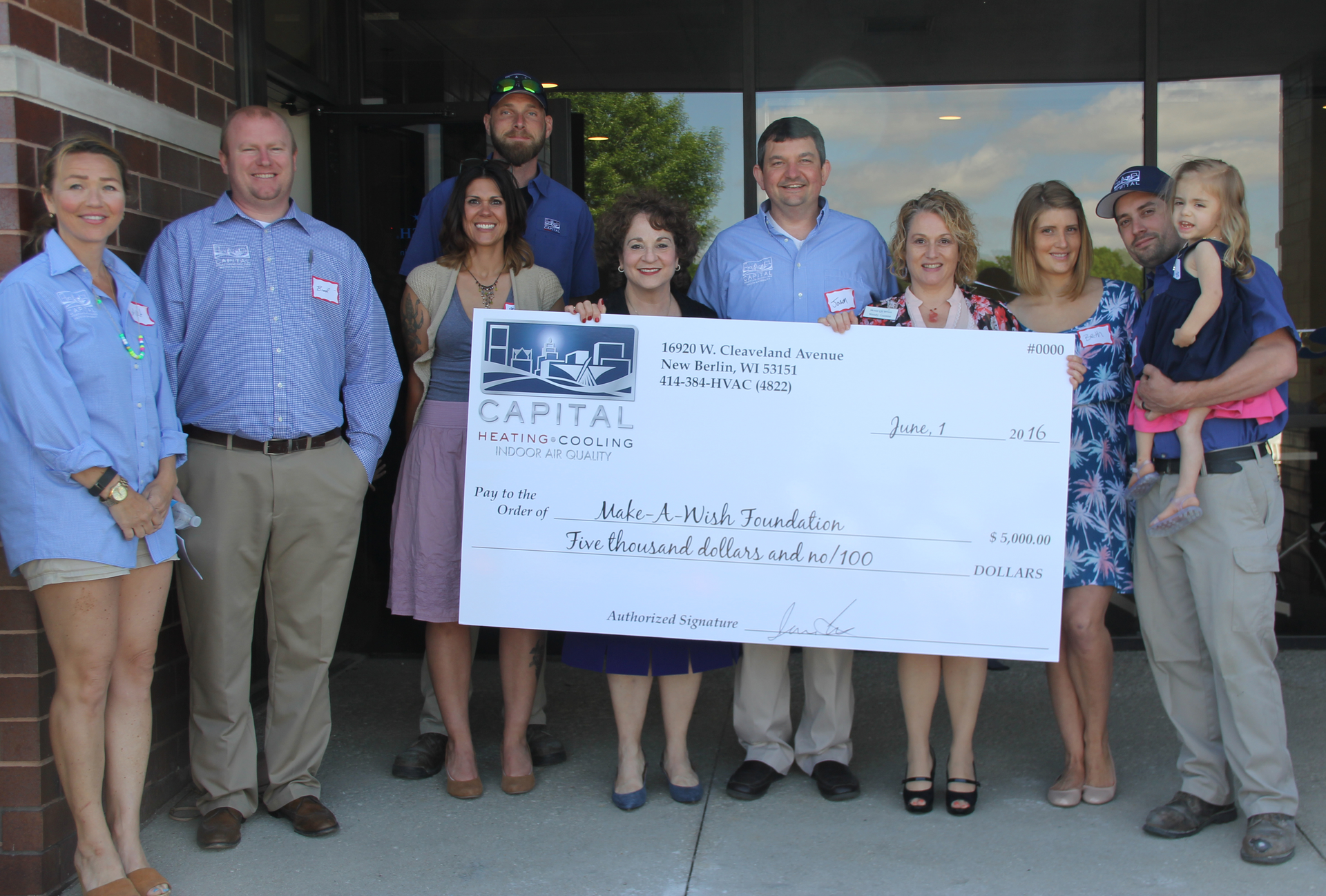 Photo shows presentation at the grand opening event Capital Heating amp Cooling presented a 5000 check to MakeAWish The HVAC system in the building was donated by the Luxaire brand of Johnson Controls and installed by Capital Heating amp Cooling