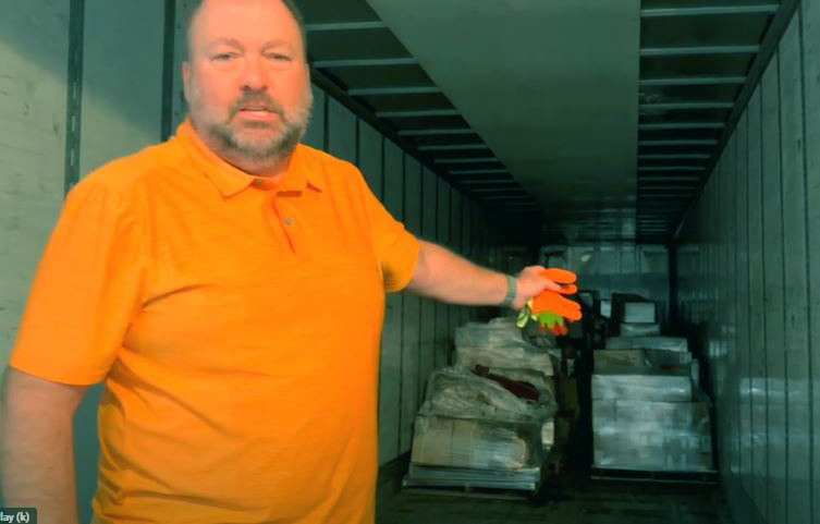 Matt Sonnhalter with the large donation by Supply Smart for the Greater Cleveland Habitat for Humanity.