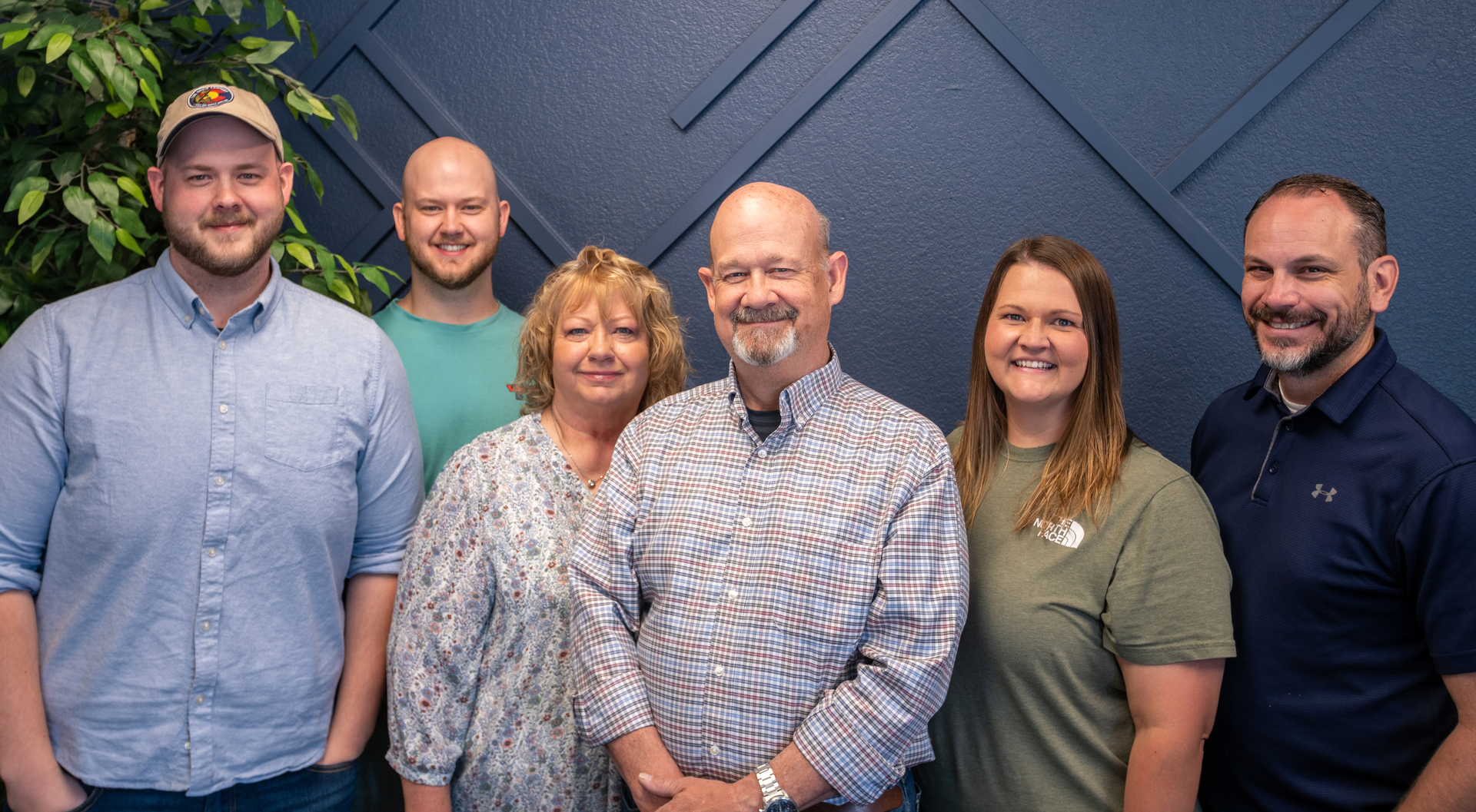 At Nomad, Bill Burnett, center, has created a hybrid between a medium-sized company and a small family business.