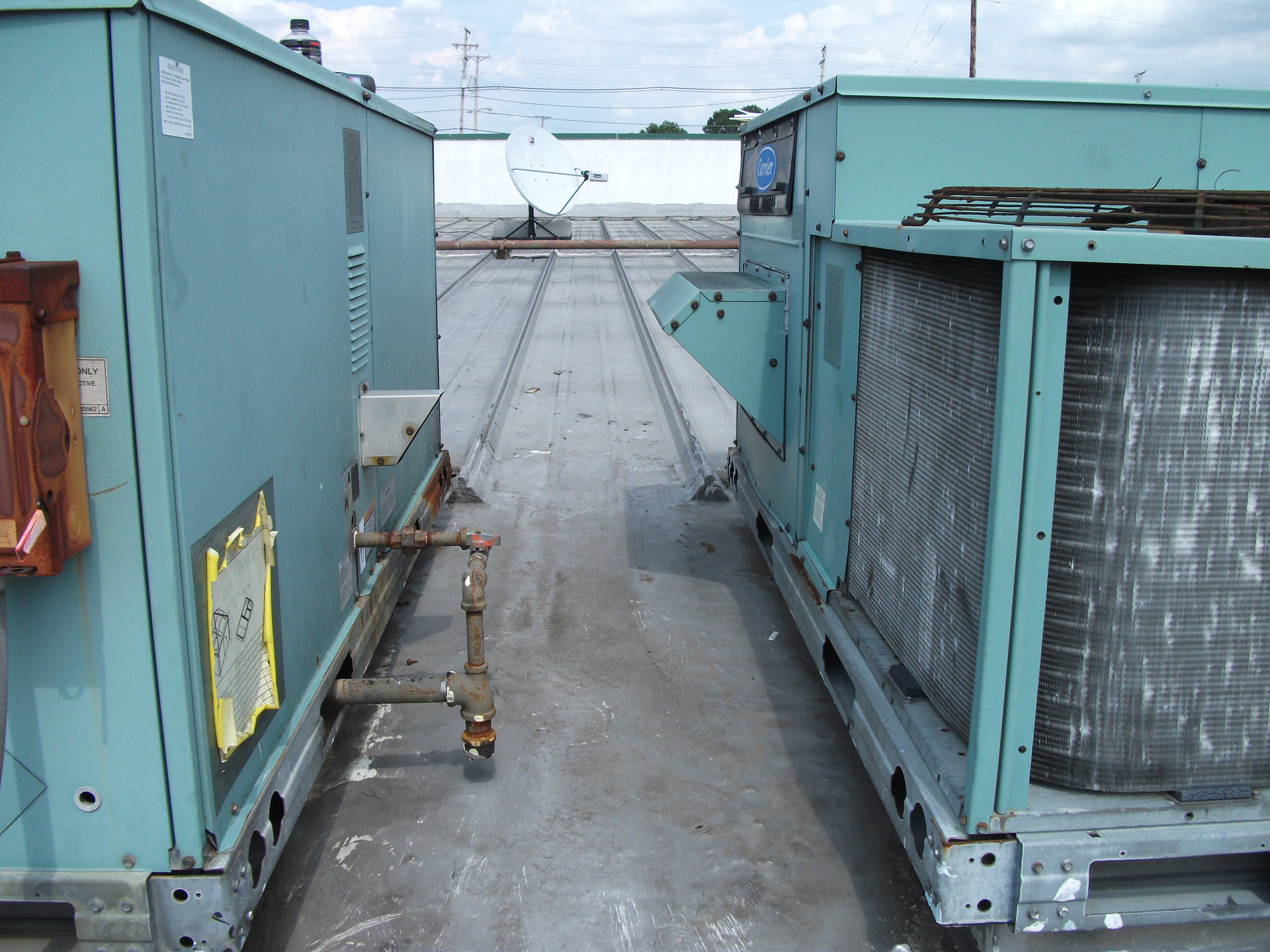 If you know what to look for, a visual inspection provides clues to unsafe operation. It's never good for one package unit to exhaust into the economizer of an adjacent unit.