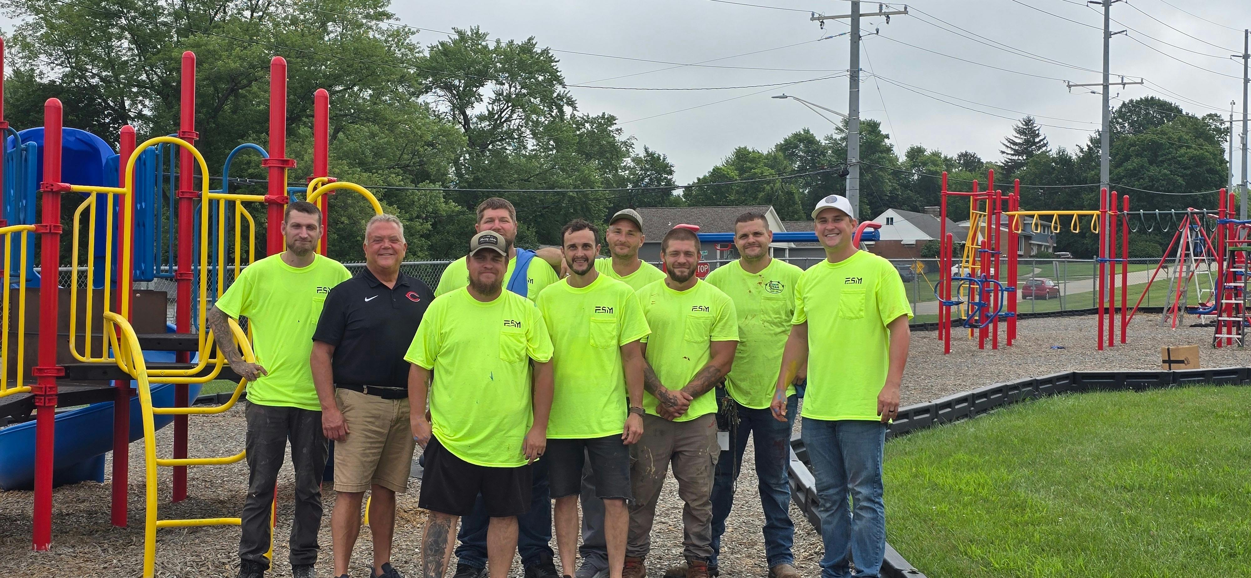 Steve Martin (second left) and Seth Martin (far right) with a team for Four Star employees at a volunteer community event.