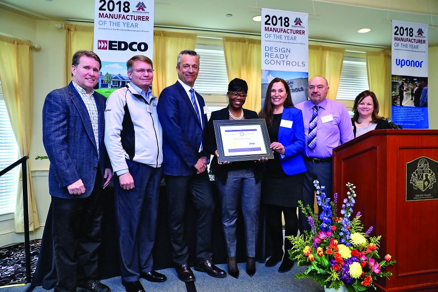 Local dignitaries join Uponor North America executives in celebrating the Manufacturers Alliance award