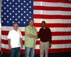John Smith center is thanked for his work at the Challenger Space Center by the facilitys Maynard Mast left and Tim Harris right John Smith center is thanked for his work at the Challenger Space Center by the facilitys Maynard Mast left and Tim Harris right