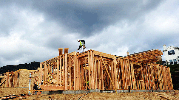 A construction worker builds a new home at the Rosedale master planned community in Azusa California