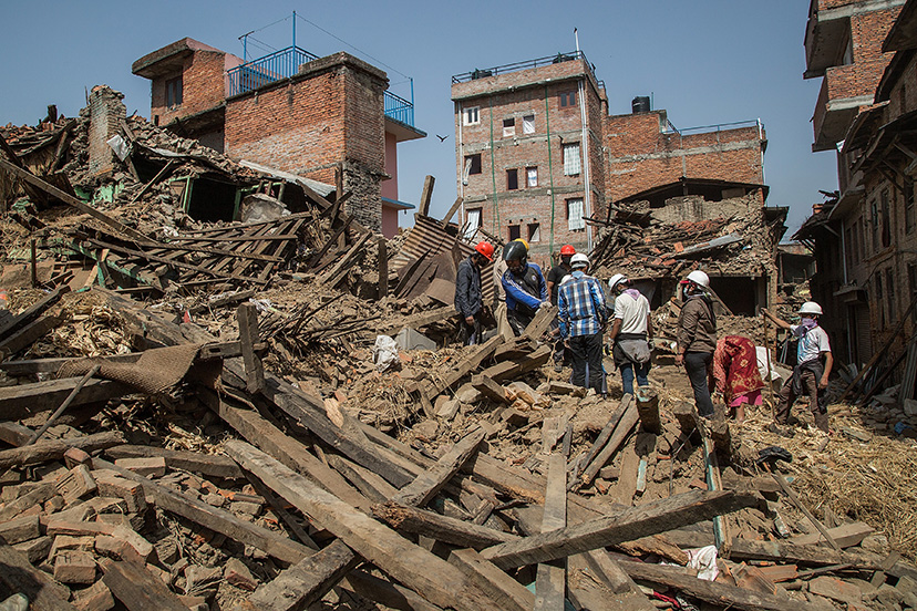 Volunteers and Nepal Scouts clear debris in a square on May 1 2015 in Harisiddhi Nepal A major 78 earthquake hit Kathmandu midday on Saturday and was followed by multiple aftershocks that triggered avalanches on Mt Everest which buried mountain climbers in their base camps Many houses buildings and temples in the capital were destroyed during the earthquake leaving over 6000 dead and many more trapped under the debris